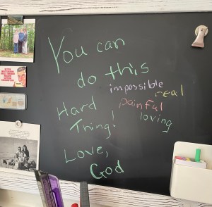 A blackboard with the message: You can do this (impossible, real, painful, loving) Hard Thing! Love, God