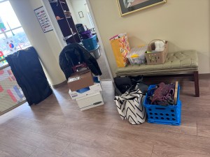 a lot of boxes and bags from moving out of an office