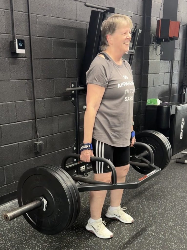 Woman lifting 162 lbs on a trap bar